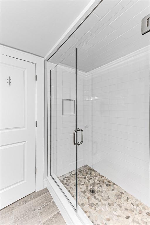 bathroom with a shower stall