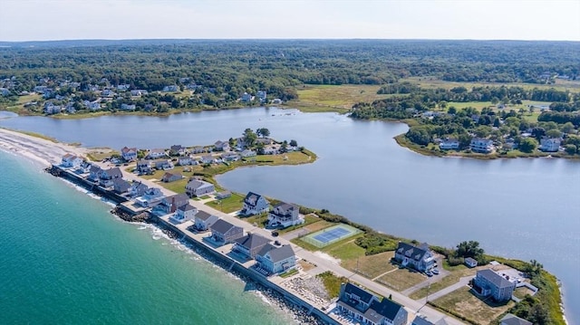 aerial view with a water view and a view of trees