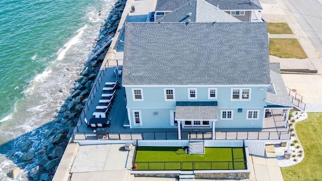 aerial view featuring a water view and a view of the beach