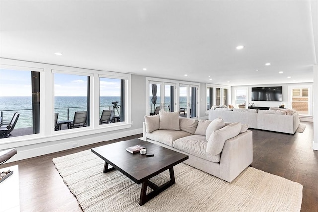 living room featuring recessed lighting, plenty of natural light, and wood finished floors