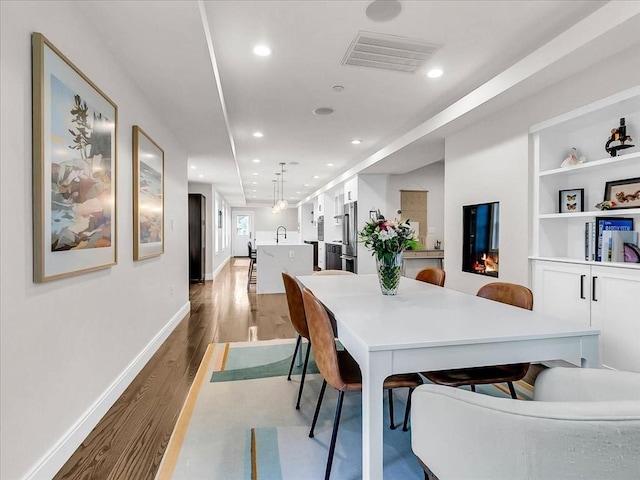 72-74 Grafton St Unit 2, Arlington, MA 02474 - dining space with light wood-style flooring, recessed lighting, and baseboards