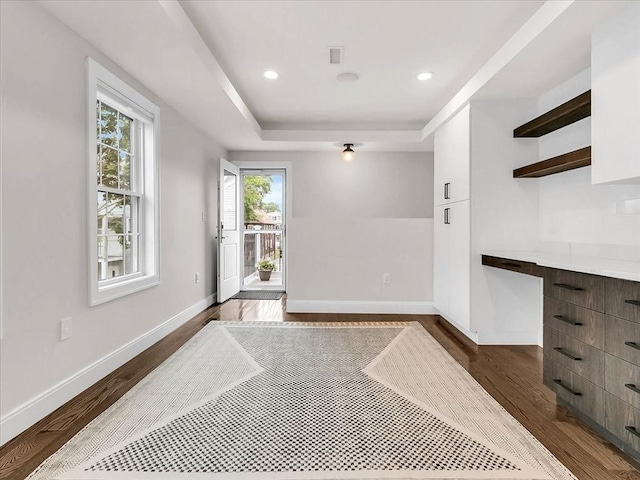72-74 Grafton St Unit 2, Arlington, MA 02474 - unfurnished dining area with dark wood finished floors, a raised ceiling, baseboards, and recessed lighting