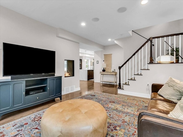 72-74 Grafton St Unit 2, Arlington, MA 02474 - living room featuring stairs, wood finished floors, baseboards, and recessed lighting