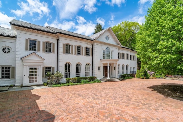 200 Pond Rd, Wellesley, MA 02482 - georgian-style home featuring brick siding and decorative driveway