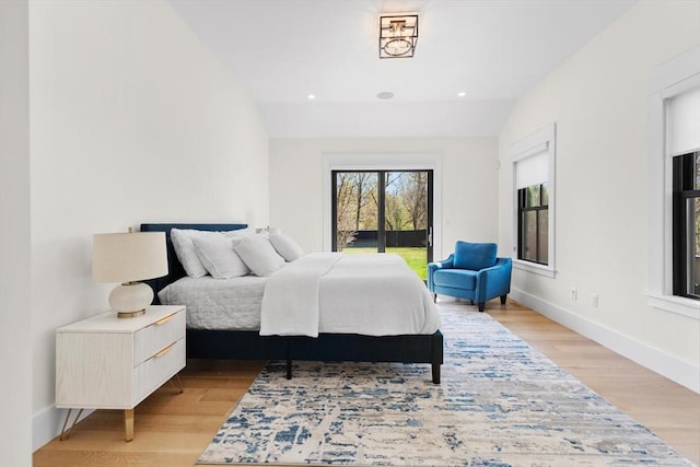 7 Fulton Rd, Lexington, MA 02420 - bedroom featuring baseboards, vaulted ceiling, access to exterior, and light wood finished floors