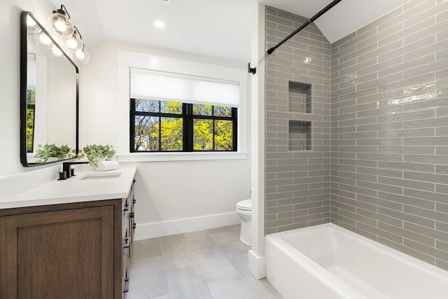 7 Fulton Rd, Lexington, MA 02420 - bathroom featuring vanity, lofted ceiling, toilet, baseboards, and washtub / shower combination