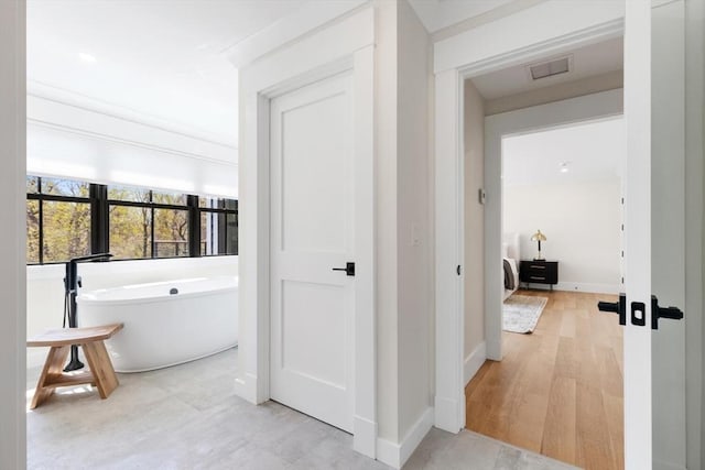 7 Fulton Rd, Lexington, MA 02420 - interior space with visible vents, a freestanding tub, and baseboards