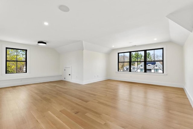 7 Fulton Rd, Lexington, MA 02420 - additional living space with light wood-type flooring, recessed lighting, baseboards, and lofted ceiling