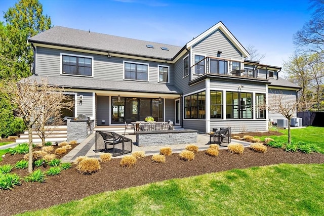 7 Fulton Rd, Lexington, MA 02420 - back of house with a lawn, a patio, and central AC