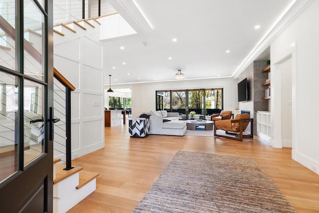 7 Fulton Rd, Lexington, MA 02420 - living area featuring light wood-style floors, recessed lighting, baseboards, and stairway