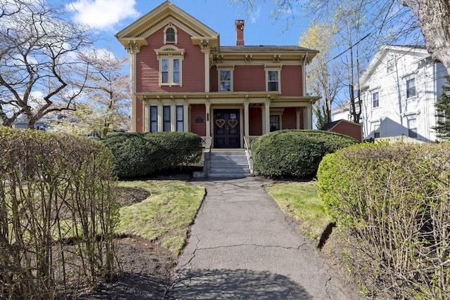 122 W Wyoming Ave Unit B, Melrose, MA 02176 - italianate-style house featuring a chimney