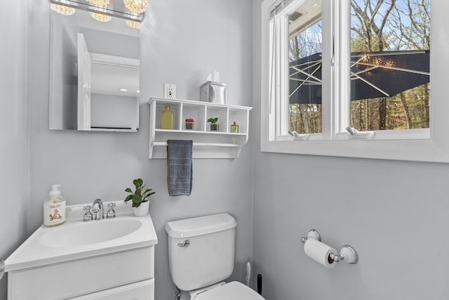 bathroom with toilet and vanity