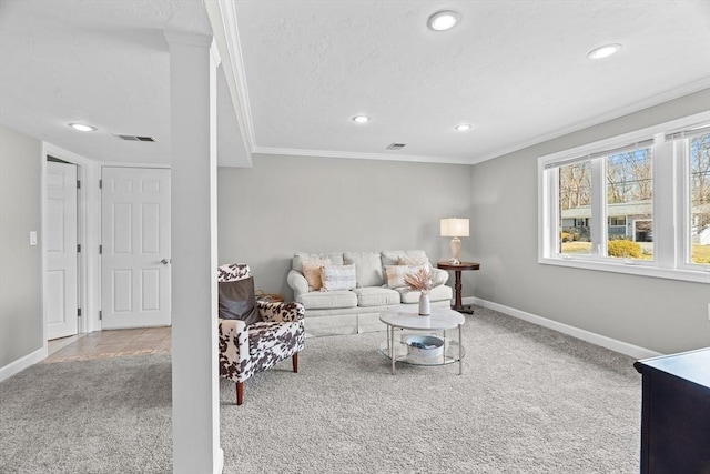 living room featuring carpet, baseboards, visible vents, recessed lighting, and crown molding