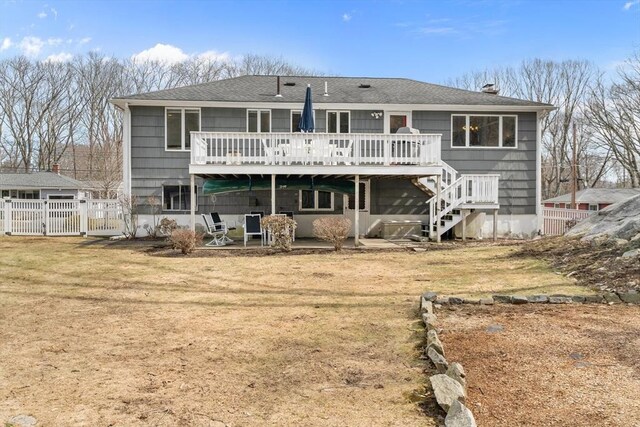 back of house with a patio, stairway, fence, a deck, and a lawn