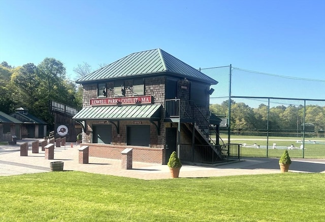 view of community featuring a yard and stairway