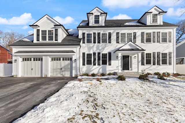 colonial inspired home featuring a garage