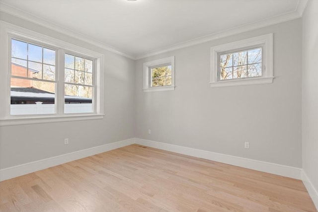 unfurnished room with light wood-type flooring and ornamental molding