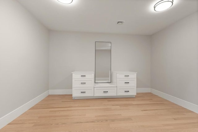 unfurnished bedroom with light wood-type flooring