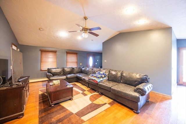 living room featuring lofted ceiling, a ceiling fan, light wood-style floors, a baseboard radiator, and baseboards