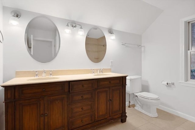 full bath with tile patterned floors, double vanity, a sink, and toilet