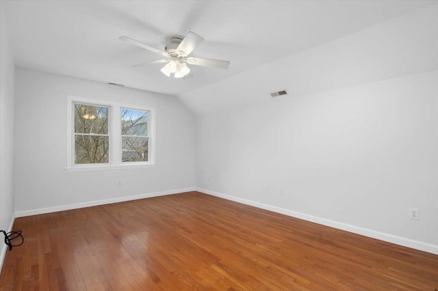 interior space featuring visible vents, hardwood / wood-style flooring, baseboards, and ceiling fan