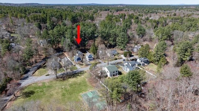 aerial view featuring a wooded view