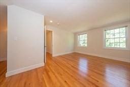 spare room with light wood-type flooring