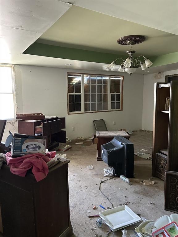 living area featuring a notable chandelier