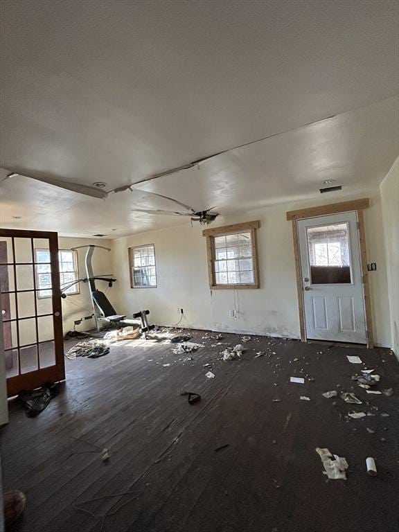 interior space with visible vents and wood finished floors