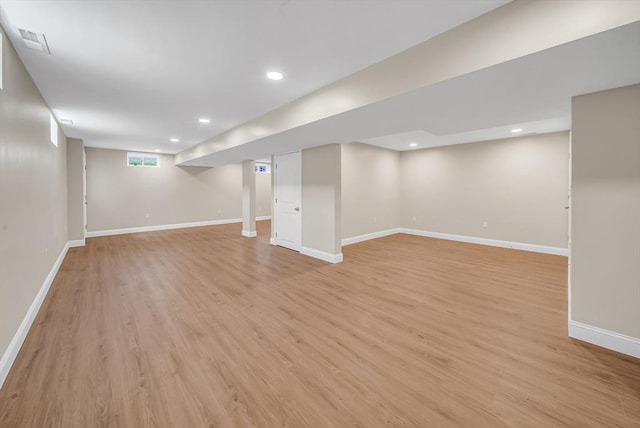 basement with light wood finished floors, baseboards, and recessed lighting