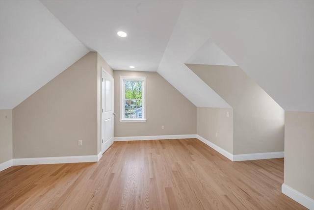 bonus room featuring light wood-type flooring, lofted ceiling, baseboards, and recessed lighting