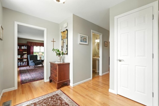 167 Orchard Rd, East Longmeadow, MA 01028 - hallway with light wood-style floors and baseboards