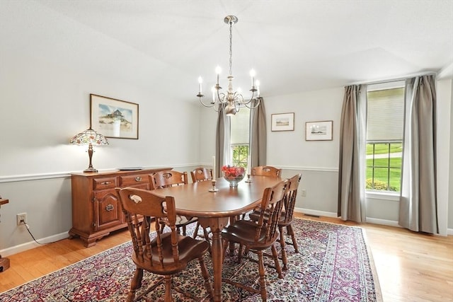 167 Orchard Rd, East Longmeadow, MA 01028 - dining room with a chandelier, light wood finished floors, plenty of natural light, and baseboards