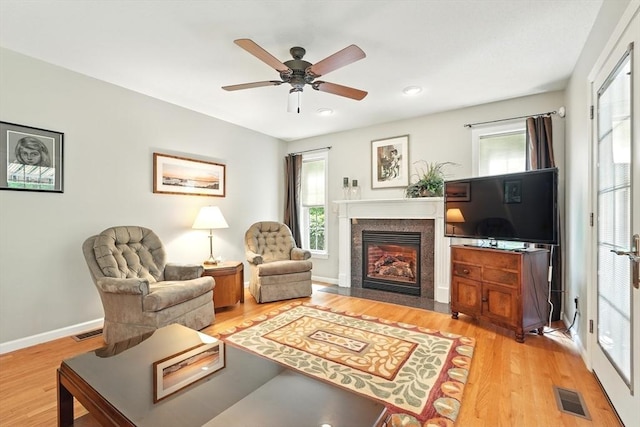 167 Orchard Rd, East Longmeadow, MA 01028 - living room with light wood-style floors, a fireplace with flush hearth, ceiling fan, recessed lighting, and baseboards