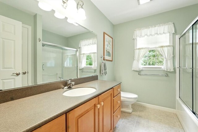 167 Orchard Rd, East Longmeadow, MA 01028 - full bathroom featuring toilet, vanity, healthy amount of natural light, and baseboards