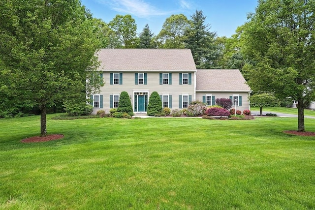 167 Orchard Rd, East Longmeadow, MA 01028 - colonial house with a front yard and a shingled roof