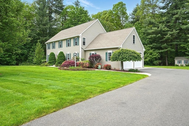 167 Orchard Rd, East Longmeadow, MA 01028 - colonial inspired home featuring a front lawn, roof with shingles, driveway, and an attached garage