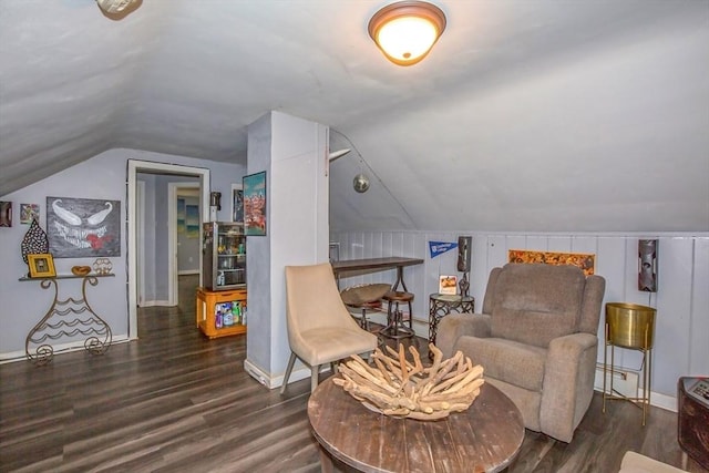 37 Border St, Springfield, MA 01104 - living area with lofted ceiling, wood finished floors, and a baseboard radiator