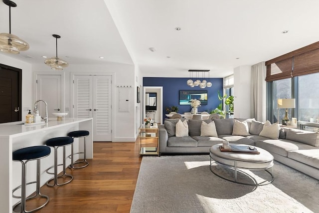 living room featuring dark wood finished floors and recessed lighting