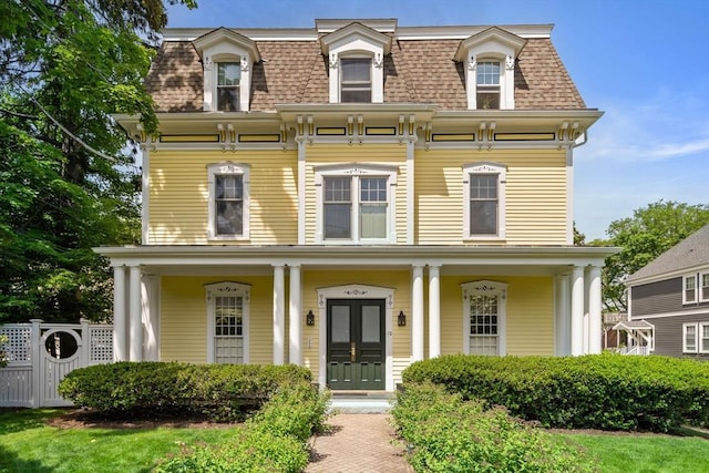 19 Woodbine St Unit B, Newton, MA 02466 - second empire-style home featuring mansard roof, a porch, and a shingled roof