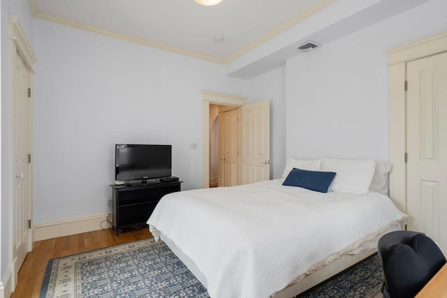 19 Woodbine St Unit B, Newton, MA 02466 - bedroom with wood finished floors, crown molding, and baseboards