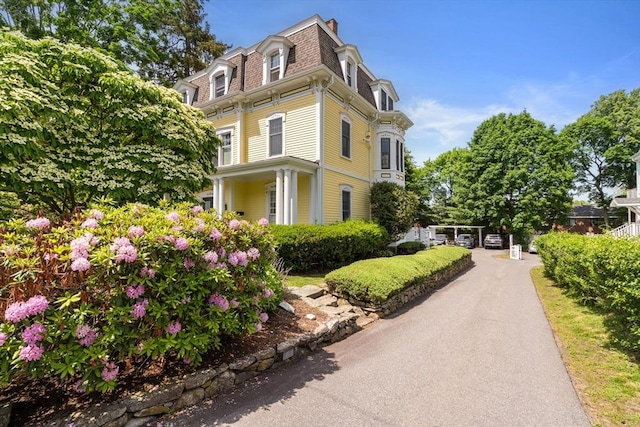 19 Woodbine St Unit B, Newton, MA 02466 - view of home's exterior featuring mansard roof and a chimney