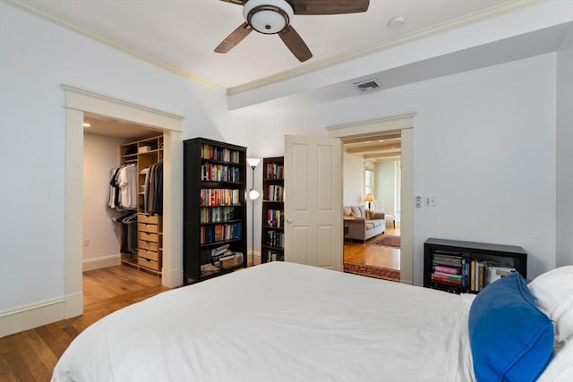 19 Woodbine St Unit B, Newton, MA 02466 - bedroom featuring ornamental molding, wood finished floors, baseboards, a walk in closet, and a closet