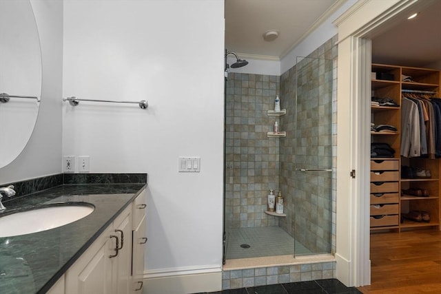19 Woodbine St Unit B, Newton, MA 02466 - full bathroom featuring vanity, a shower stall, a walk in closet, and ornamental molding