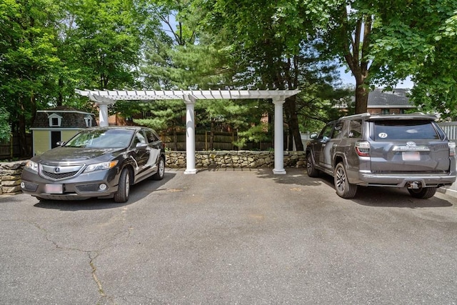 19 Woodbine St Unit B, Newton, MA 02466 - view of vehicle parking featuring a storage unit