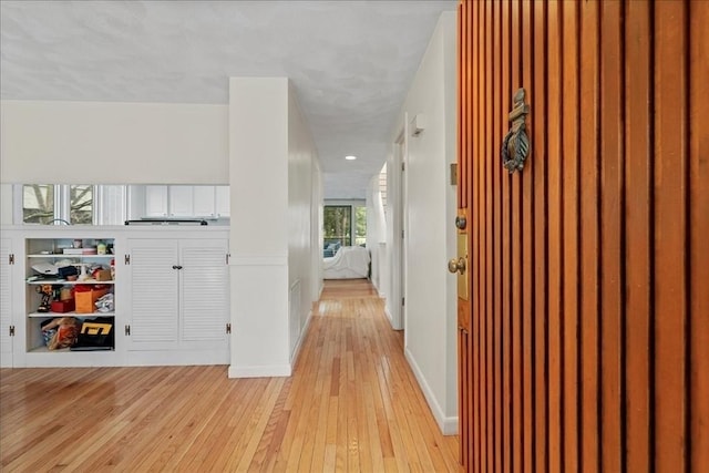 hall with light wood-style flooring