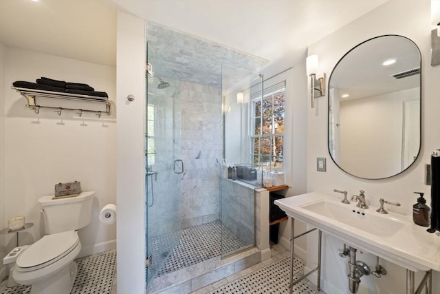 46 Church St, Dedham, MA 02026 - bathroom with tile patterned flooring, visible vents, a shower stall, baseboards, and toilet