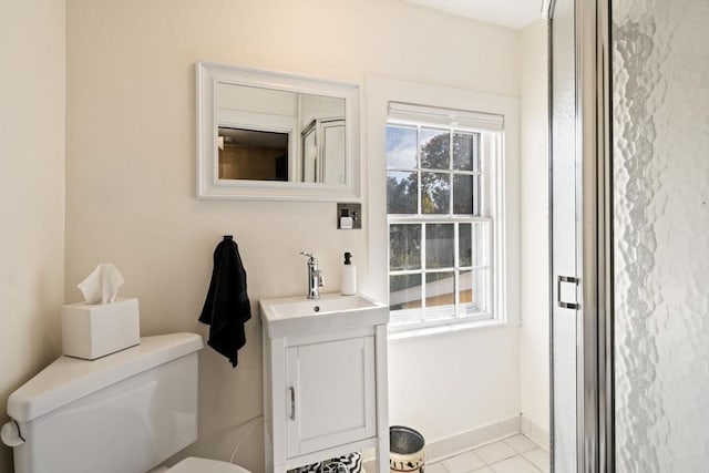 46 Church St, Dedham, MA 02026 - bathroom with baseboards, toilet, vanity, and tile patterned flooring