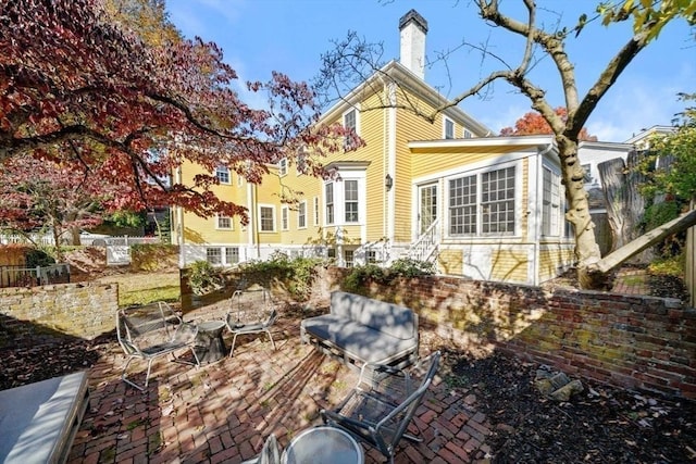 46 Church St, Dedham, MA 02026 - back of house featuring a patio, a chimney, and entry steps