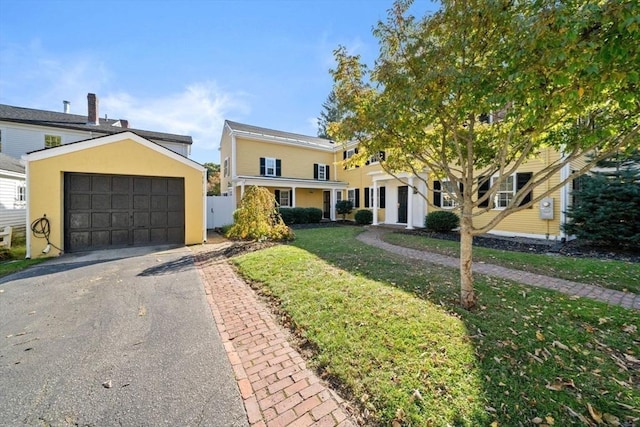 46 Church St, Dedham, MA 02026 - view of front of property with a garage, driveway, a front yard, and stucco siding